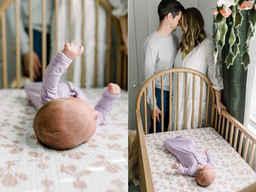 New parents lovingly admire their newborn baby in her crib for the first time