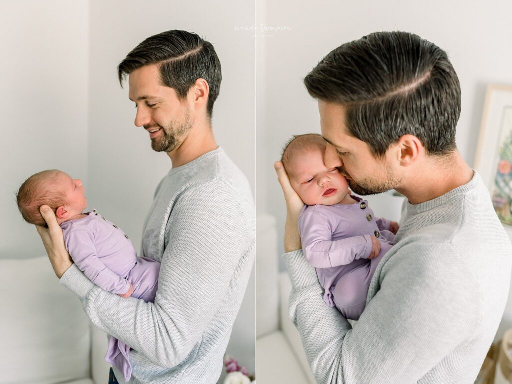 Dad smiling lovingly at newborn baby during in-home lifestyle newborn session in Katy, Texas