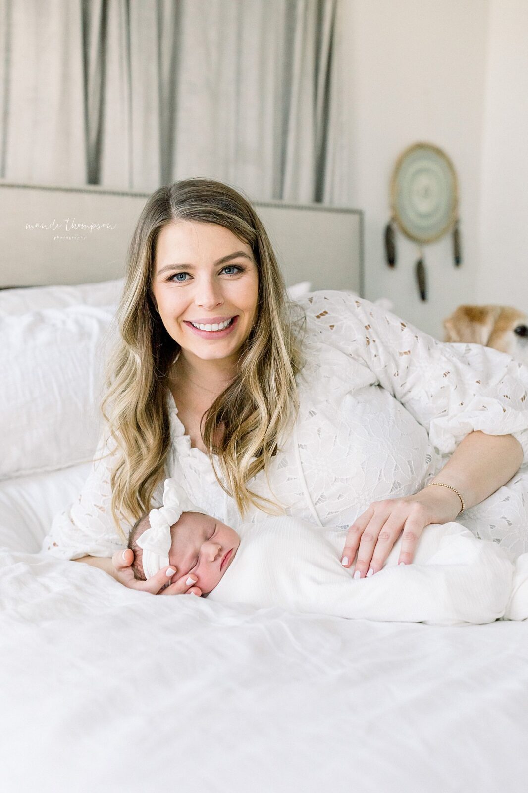 beautiful mama and baby snuggled up during their Newborn session with Mandi Thompson Photography