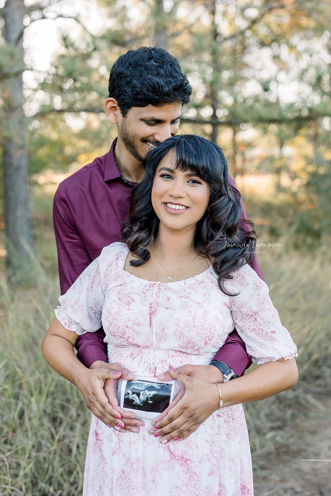 expecting parents hands on baby bump during luxury maternity session Katy TX