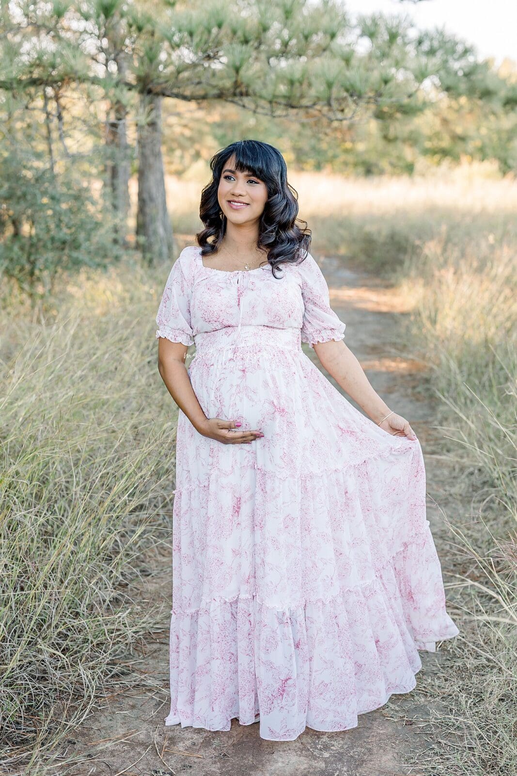 walking in a fielding during katy maternity session 