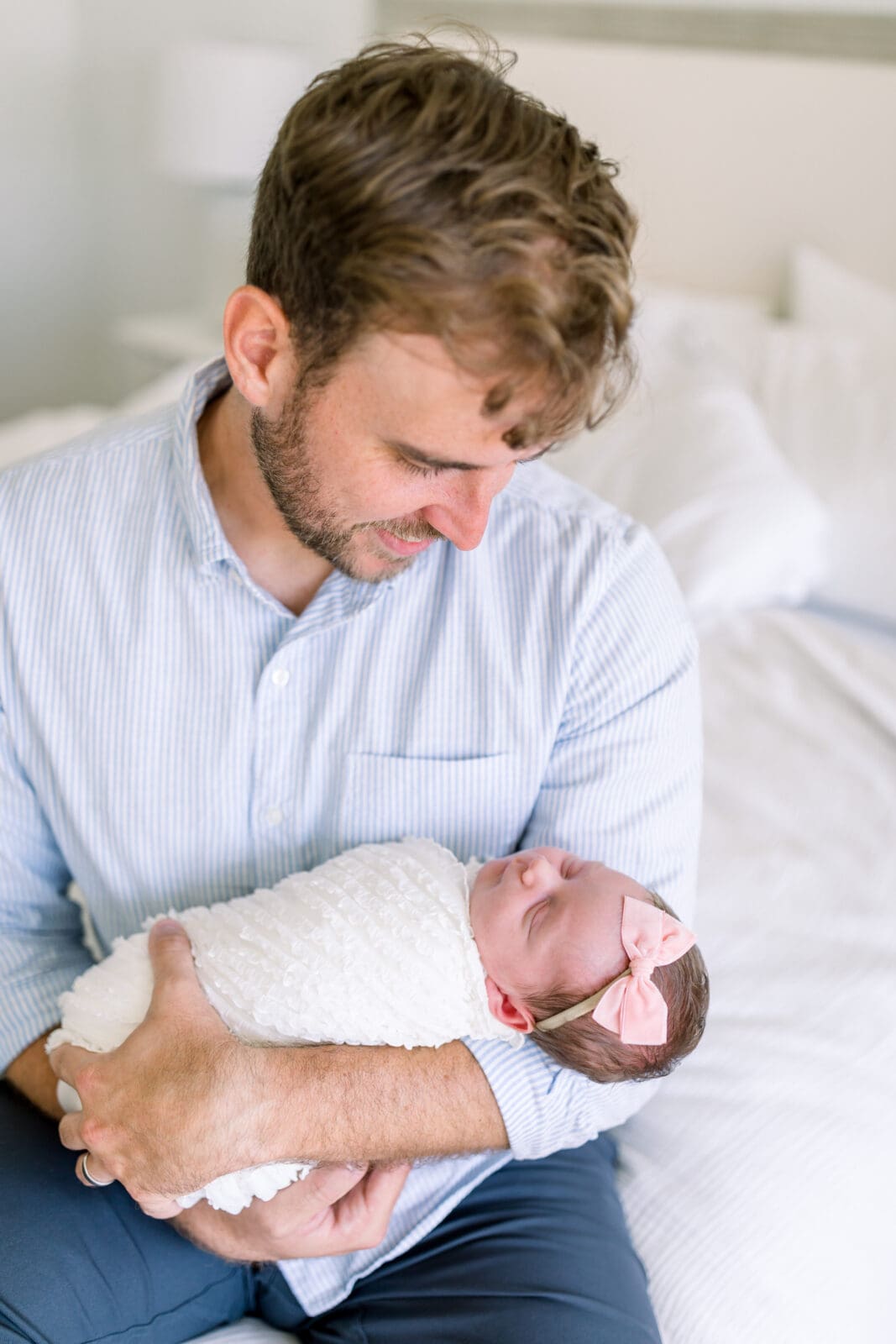 Dad bonding with newborn during lifestyle session in Katy TX