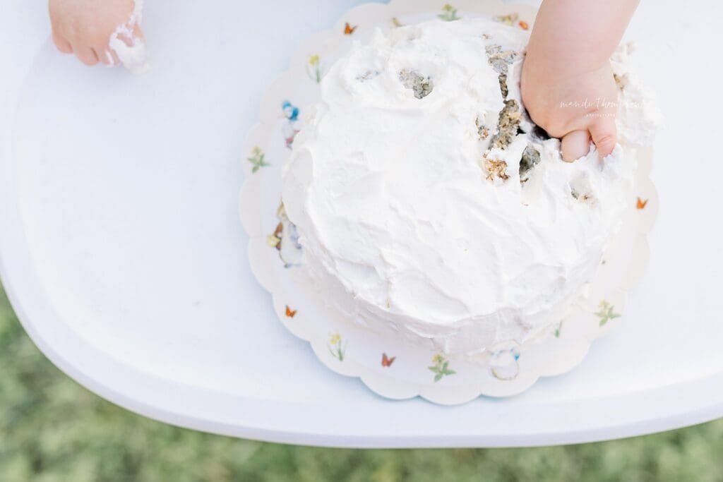 Minimal neutral cake smash setup for a one-year-old