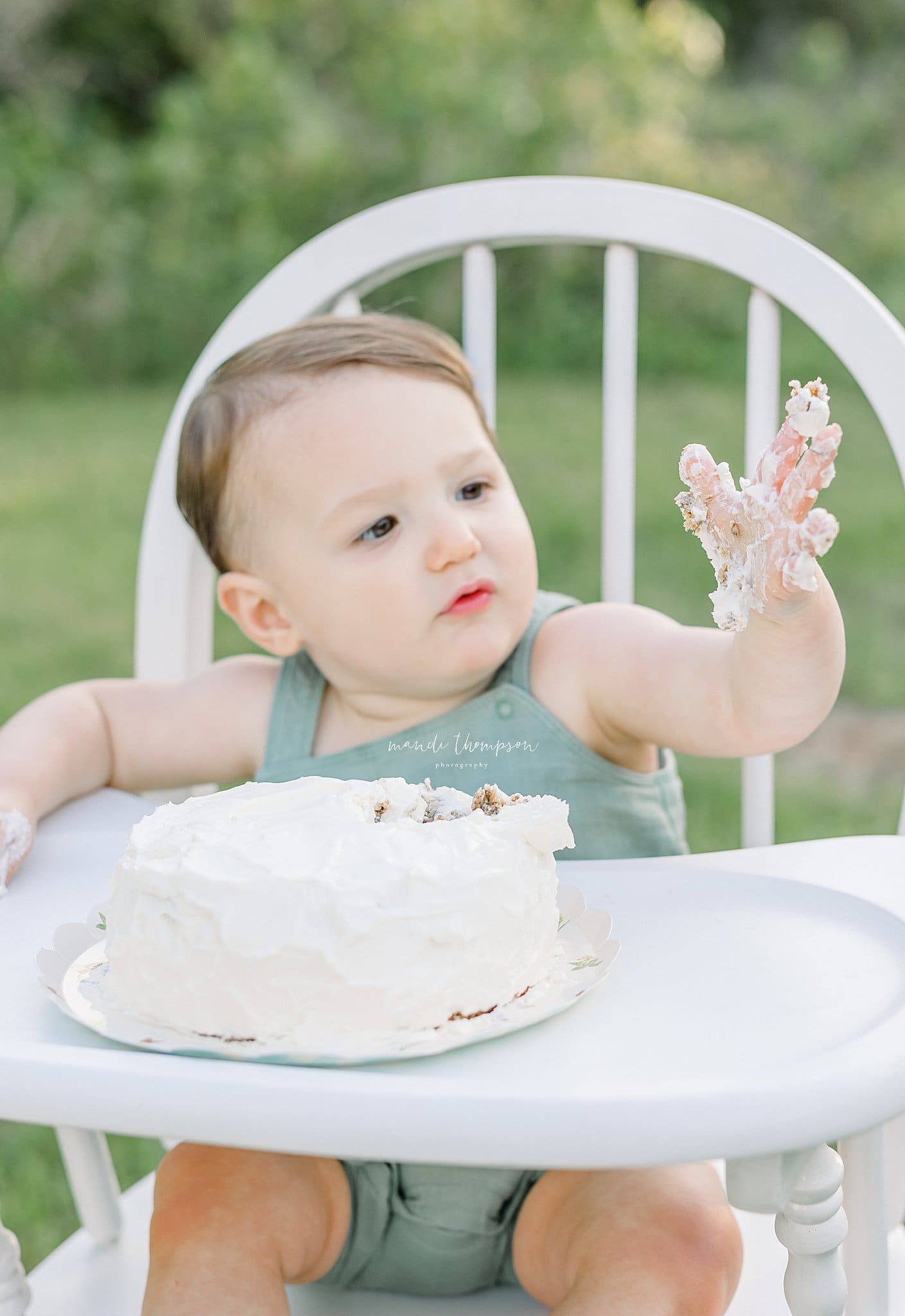 Baby enjoying cake during a lifestyle cake smash session