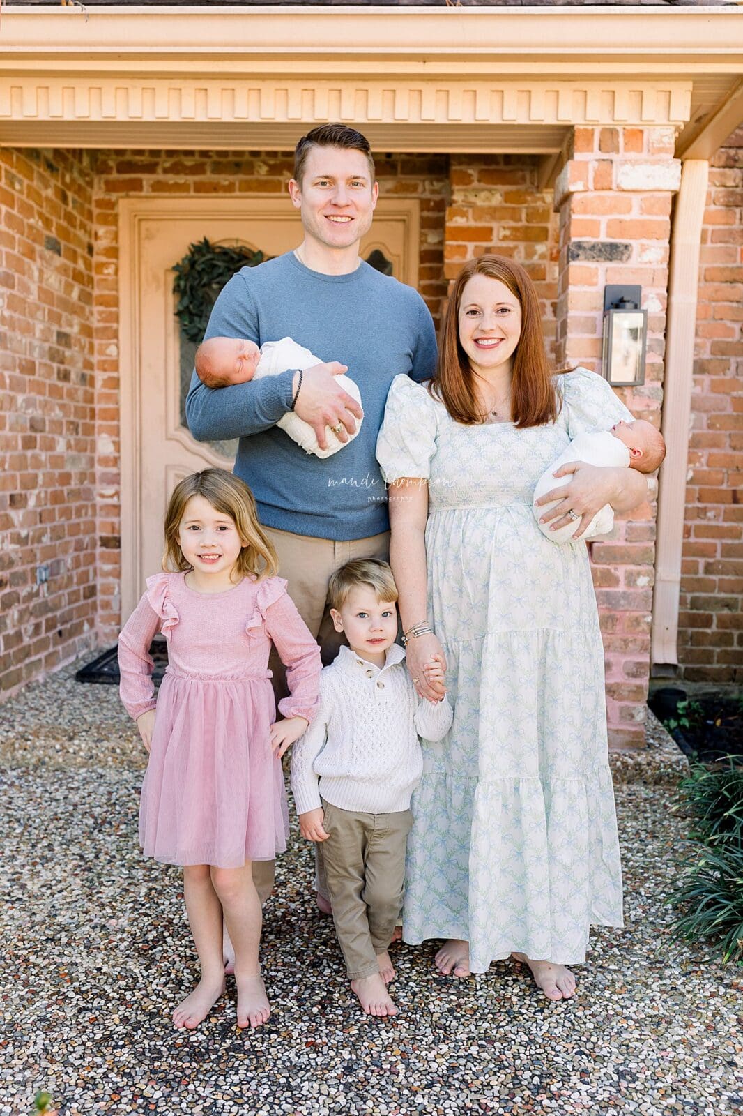 Family photographed on front porch of home in Katy TX