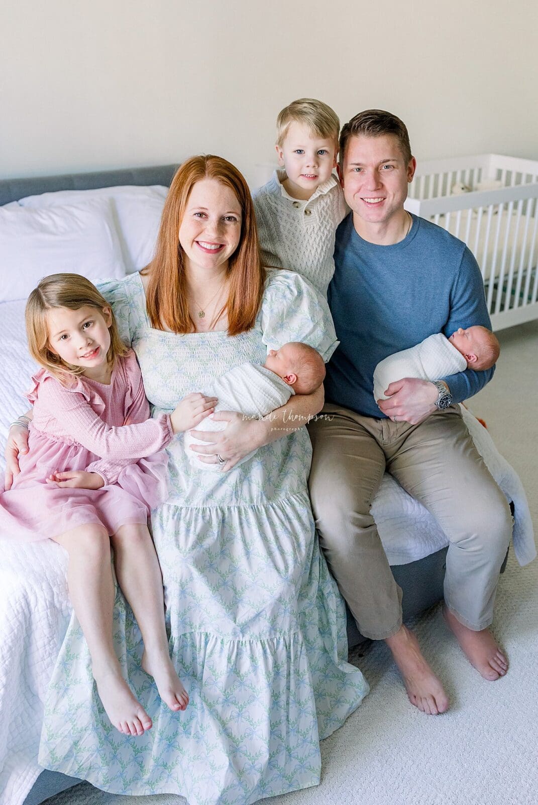 Wide shot of nursery with baby and family in natural light Katy TX